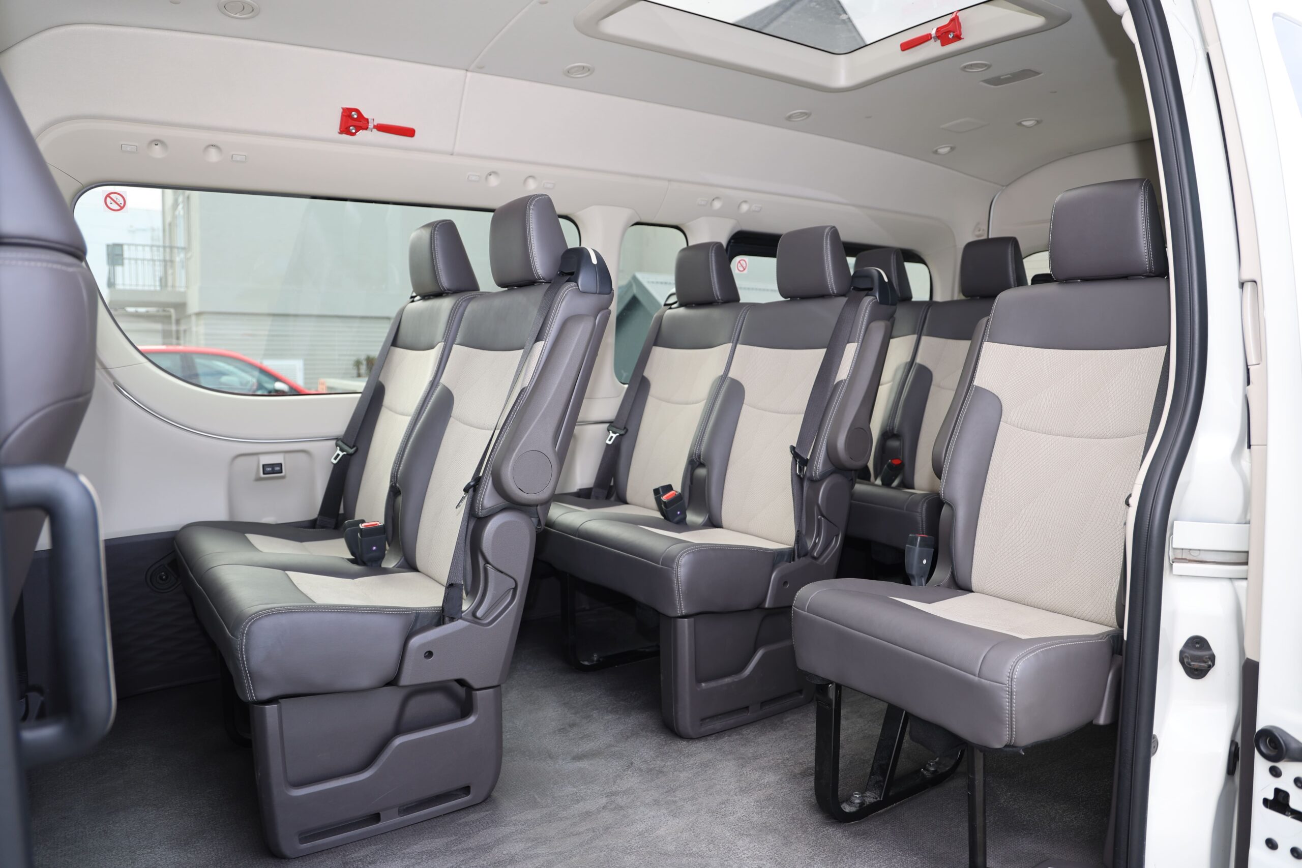 Spacious interior of a Hermanus Shuttle group van with captain's chairs